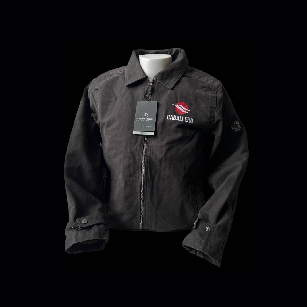 Black Stormtech jacket that has the Caballero name and logo on it. Indicates that Zone West can make customized jackets.